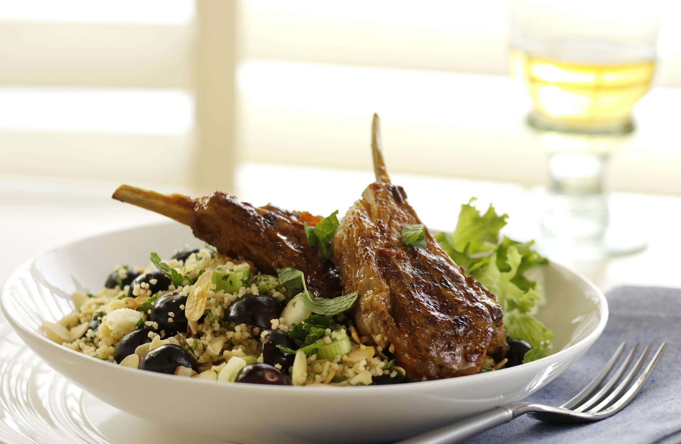 Griddled Harissa Marinated Lamb with Blueberry, Spring Onion & Toasted Almond Couscous
