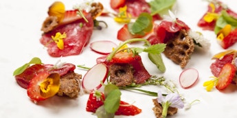 Carpaccio of Beef with pickled Strawberries, Wild Spicy Leaves & Crispbread